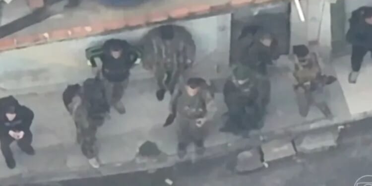 How battle of Rio unfolded as footage shows armed-to-the-teeth cartel commandos fleeing cops through bloodsoaked streets