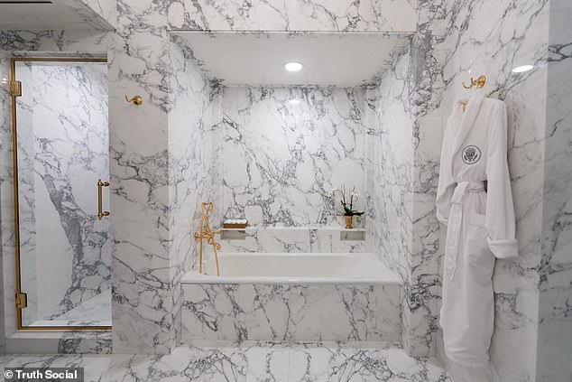 A white presidential robe hangs on the wall beside the new tub