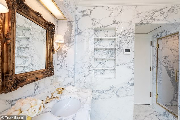 Shelves are set into the marble walls to provide a minimalist look