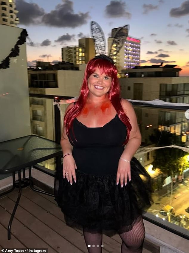 Gogglebox star Amy Tapper kept it sweet in a little black dress complete with black bunny ears and a red festive wig