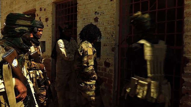 Pictured: Abu Lulu dubbed the 'butcher of the century' being led to a prison sell