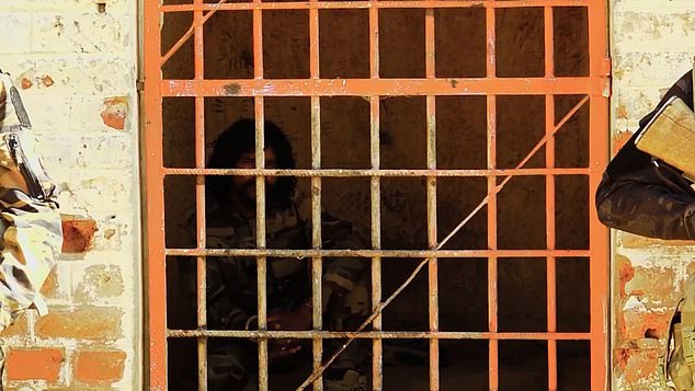 Pictured: Abu Lulu behind bars. In a video on Monday, he boasted that he may have been personally responsible for slaughtering more than 2,000