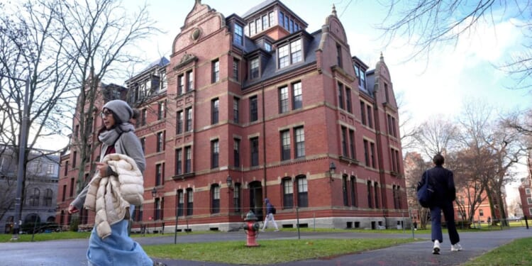 Students walk on the campus of Harvard University in Cambridge, Massachusetts, on Dec. 17, 2024.