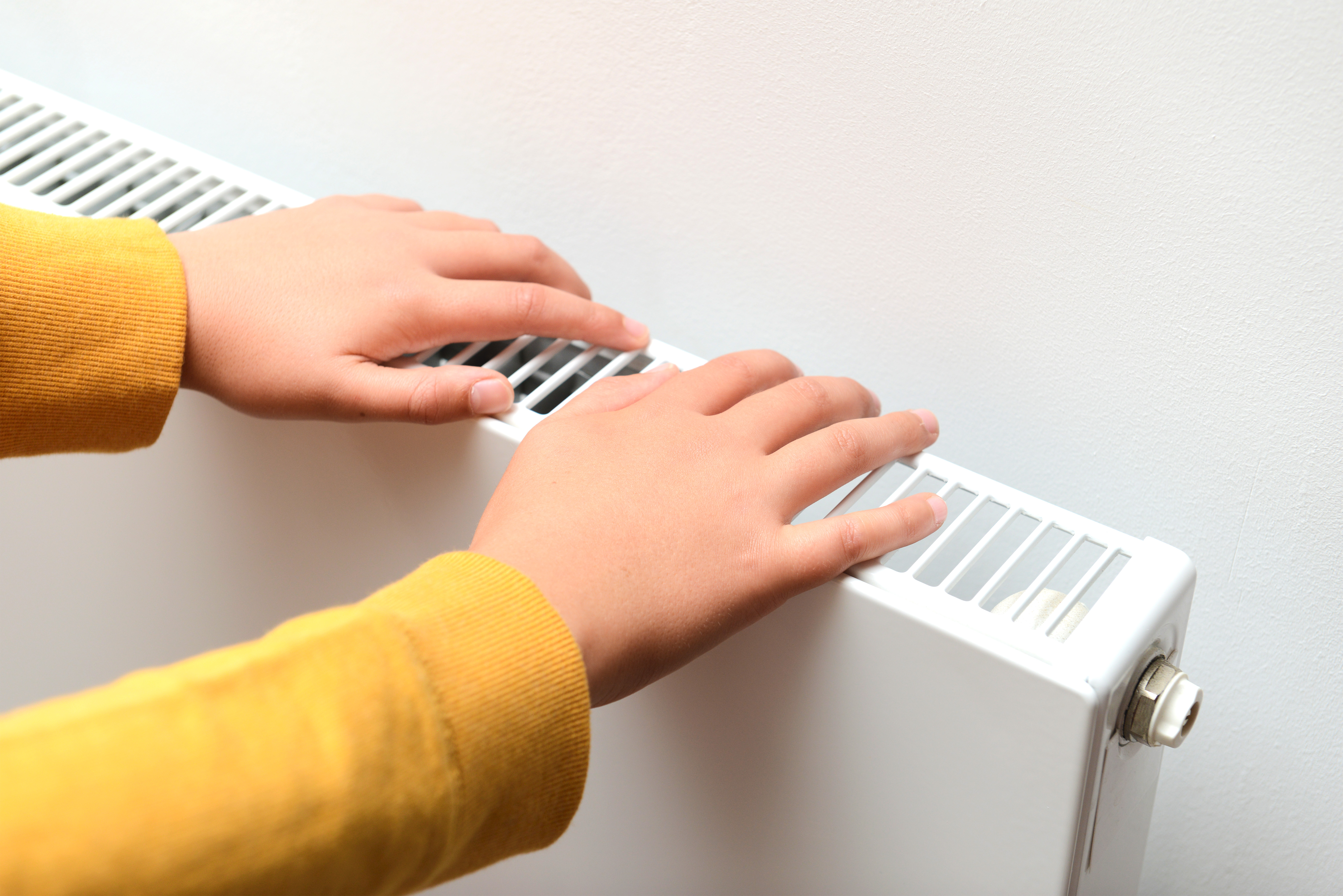 school boy keeping warm