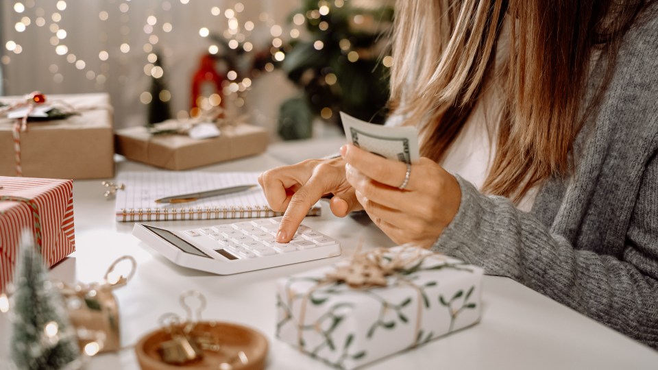 Woman budgeting holiday expenses.