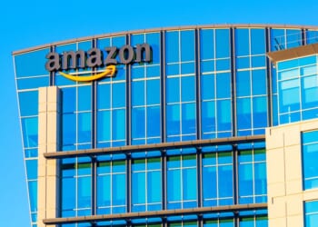 The Amazon logo is displayed on the glass exterior of Amazon.com office in Sunnyvale, California, in 2021.