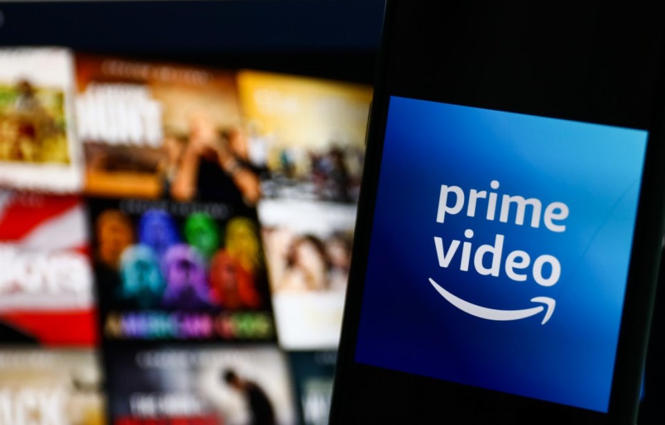 Amazon Prime Video logo displayed on a phone screen and Amazon Prime Video website displayed on a screen in the background are seen in this illustration photo taken in Krakow, Poland on July 26, 2022. (Photo by Jakub Porzycki/NurPhoto via Getty Images)