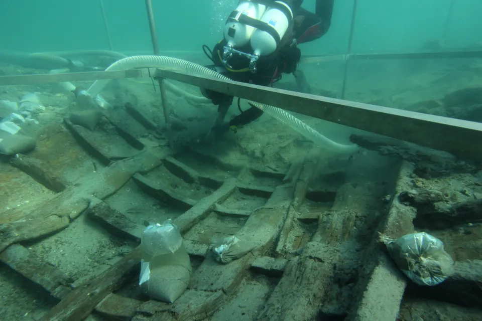 A diver working on the excavation of an ancient Roman ship.