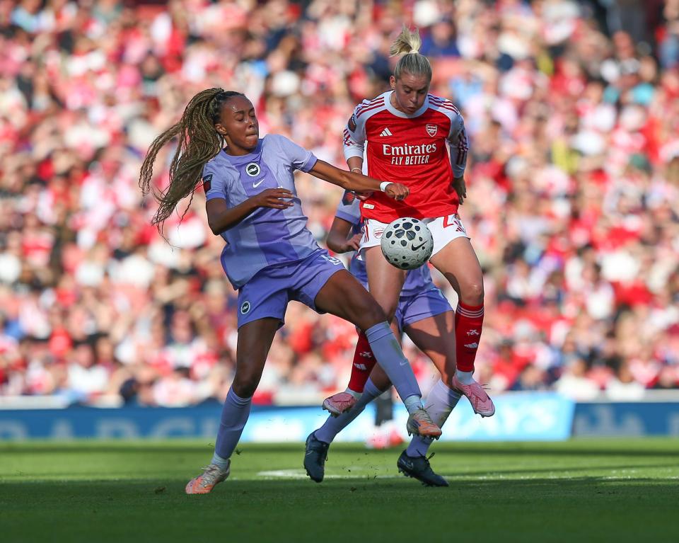 Maelys Mpome (Brighton & Hove Albion) and Alessia Russo (Arsenal) challenge for the ball during the Barclays Women's Super League game.