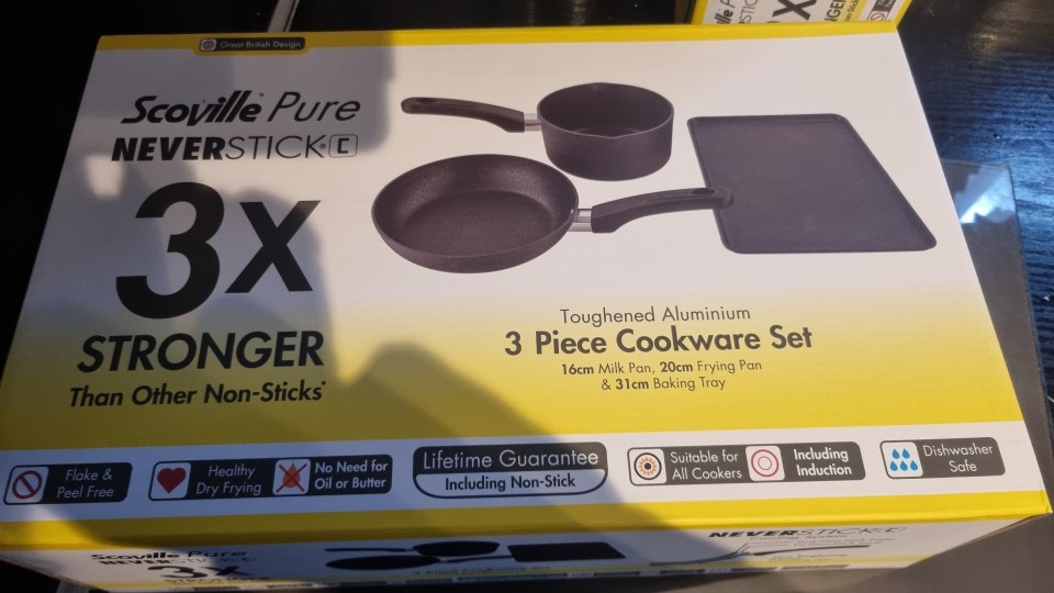 Box for a Scoville Pure Neverstick 3-piece cookware set, showing a milk pan, frying pan, and baking tray.