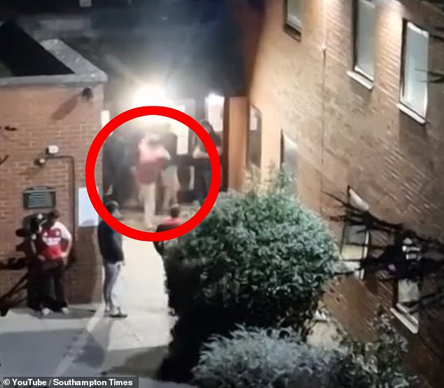 Asylum hotel residents fight among themselves, throw rocks and try to climb walls as terrified neighbours cower in their homes