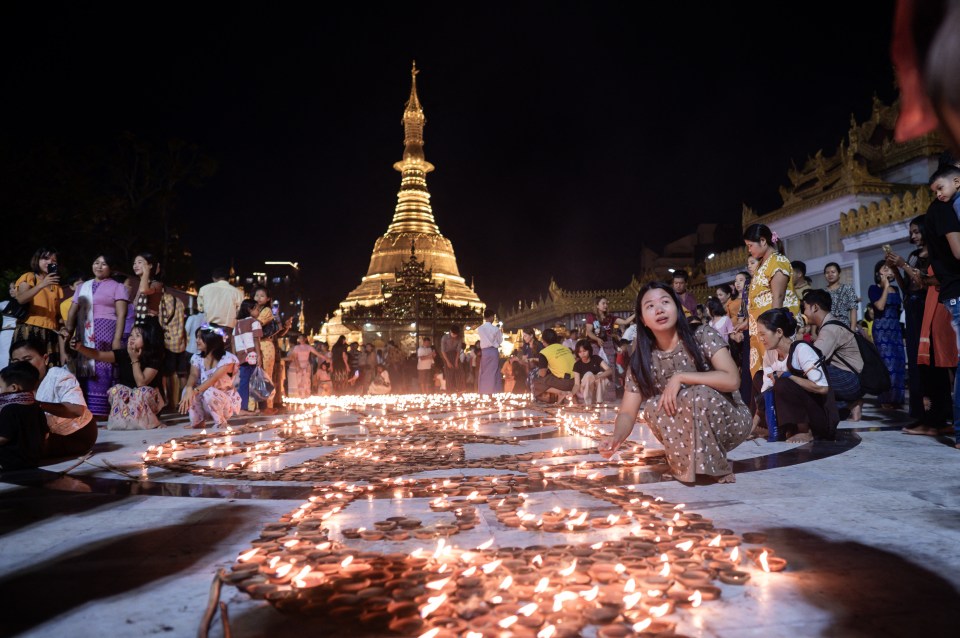 Buddhist devotees light earthern lamps at Botahtaung Pagoda to mark the full moon day of the Thadingyut festival.