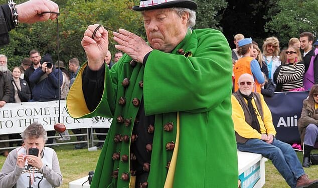 Just smashing: The BBC, which has lost rights to the Boat Race, Test cricket and the Grand National, will broadcast Sunday's World Conker Championship. Pictured: Winner David Jakins, 83, who was wrongly accused of cheating last year