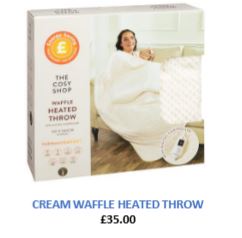 A box for a cream waffle heated throw with a picture of a woman using it.