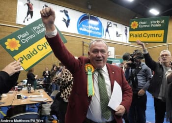 Plaid Cymru's Lindsay Whittle celebrates after being declared winner for the Caerphilly Senedd by-election