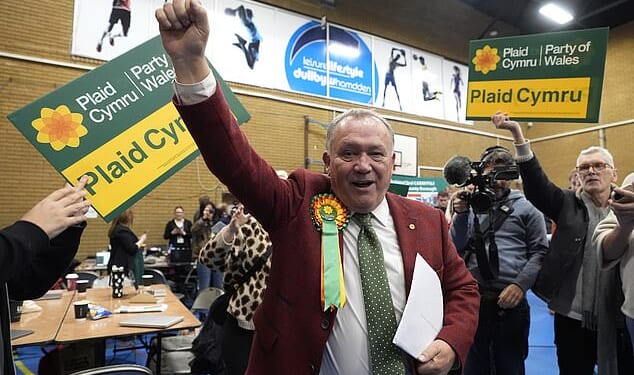 Plaid Cymru's Lindsay Whittle celebrates after being declared winner for the Caerphilly Senedd by-election