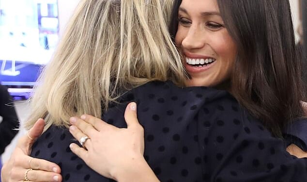The patch is slap bang on the crown of my head, writes Bryony, seen here hugging her friend Meghan