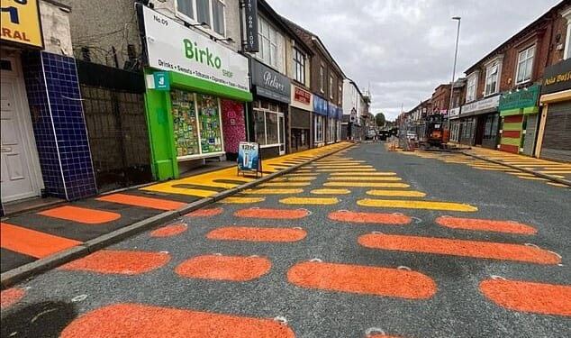 Baffled residents have claimed new road markings (pictured) that look like 'giant Wotsits' are wreaking havoc on their town