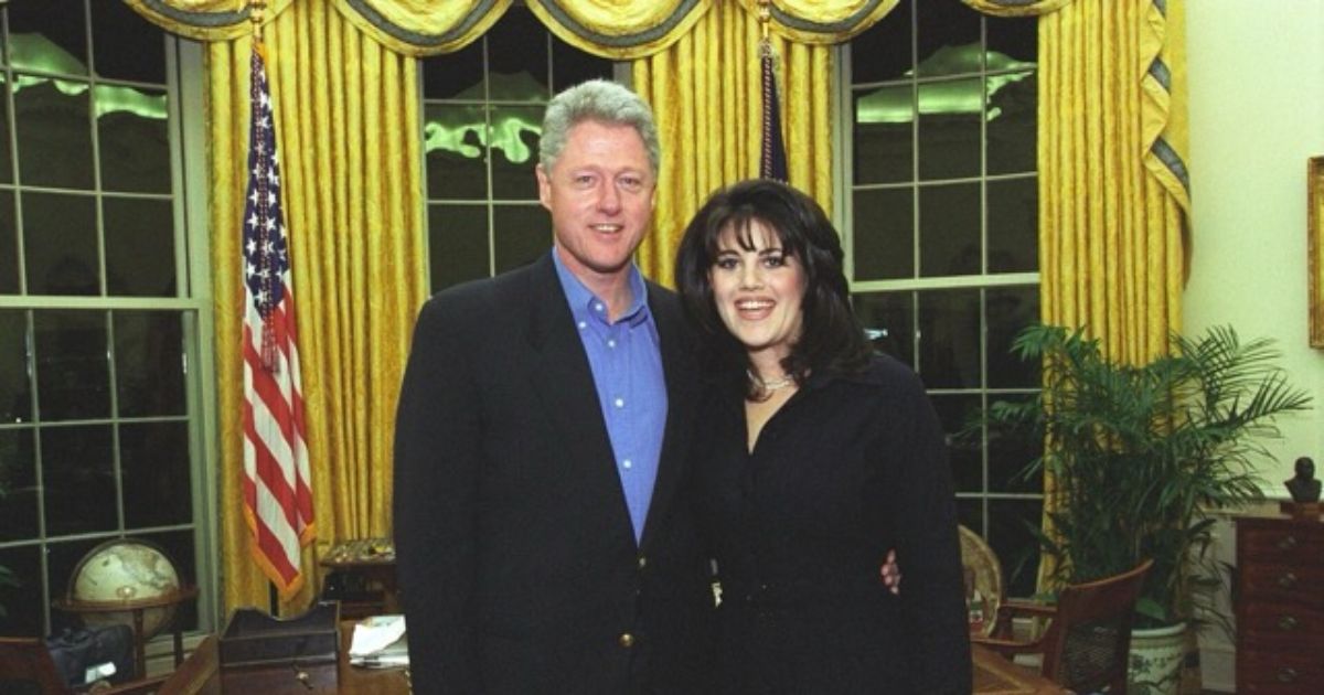 Now-former President Bill Clinton takes a photo with intern Monica Lewinsky.