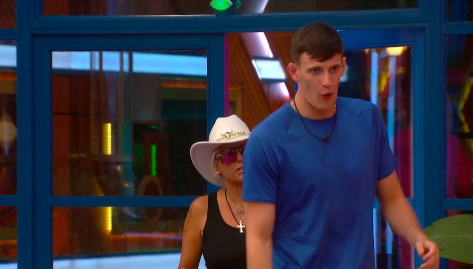 Cameron shouting as he storms off, with Feyisola in the background.