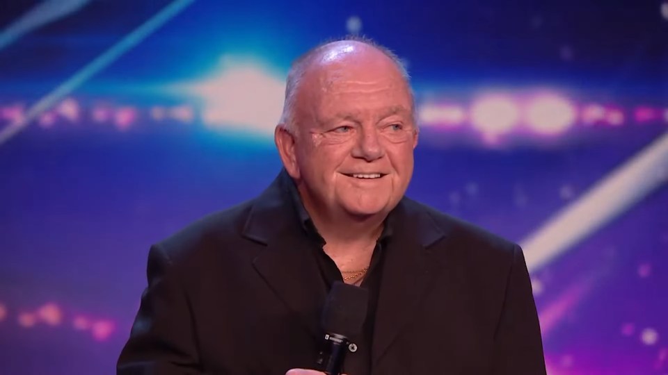 An older man smiling on stage during his Britain's Got Talent audition.