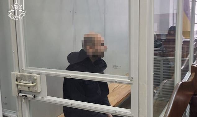 A British military instructor (pictured) accused of spying for Russia has been arrested by Ukraine's security services