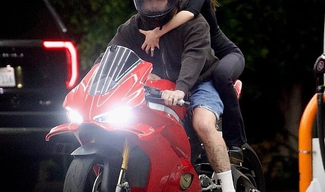 Brooklyn Beckham and his wife Nicola Peltz were seen out together on his motorbike as his mother's Netflix documentary premiered in the UK on Wednesday night