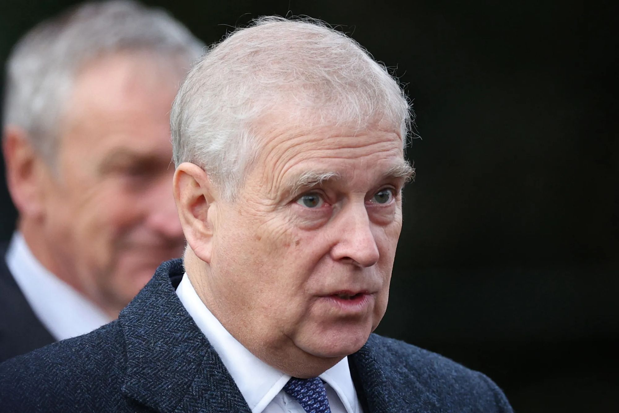 An image collage containing 1 images, Image 1 shows Britain's Prince Andrew, Duke of York, in a close-up photo, wearing a dark tweed jacket, white shirt, and blue patterned tie