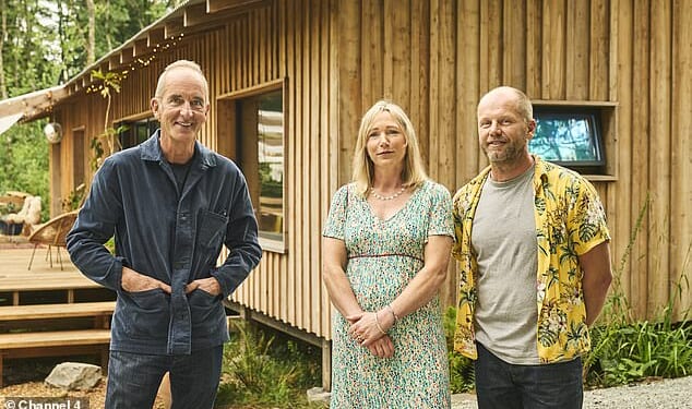 Kevin McCloud with Marcus and Abi who have built an eco-friendly cabin in the Pembrokeshire woods