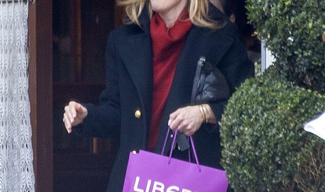 Cat Deeley looked effortlessly chic in a red roll neck jumper and navy coat as she enjoyed a girls' day out in London on Friday