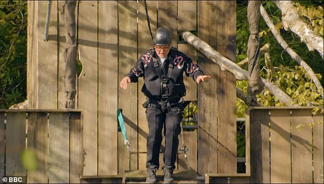 Celebrity Traitors star Alan Carr left fans in hysterics as he screamed while crossing a wobbly bridge during Wednesday's episode as viewers deem him a 'national treasure'