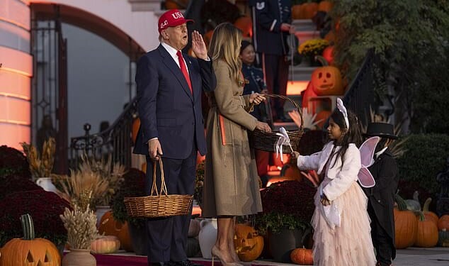 The FBI says it thwarted a potential terrorist attack this weekend as millions prepare for Halloween festivities. Pictured: Donald Trump and first lady Melania welcome trick-or-treaters to the White House on October 30, 2025