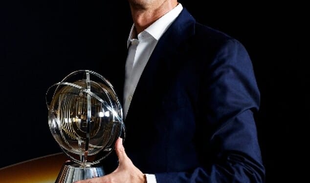 Cristiano Ronaldo, pictured with his Globo Prestigio award from Tuesday night's ceremony, is the world's first billionaire footballer - but would rather just play for Portugal