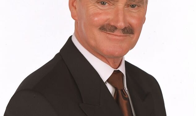 Crossroads legend Tony Adams has tragically passed away aged 84 at Sussex County Hospital in on Saturday, with his wife Christine by his side (pictured 2001)