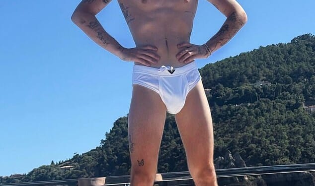 Cruz Beckham, 20, risks an embarrassing explanation with his posh parents after listening to his very explicit new single Optics which centres around drugs and sex (pictured this summer)