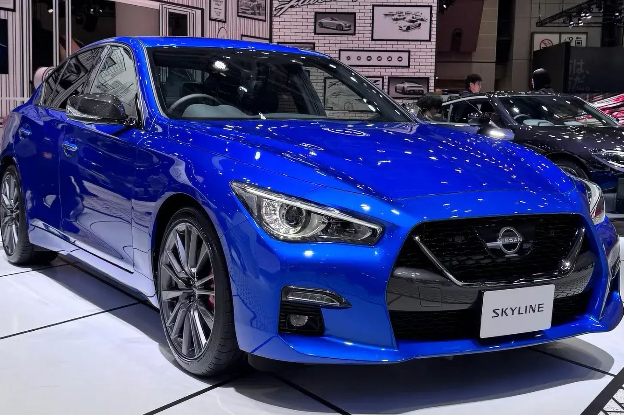 An image collage containing 1 images, Image 1 shows Blue Nissan Skyline car on display