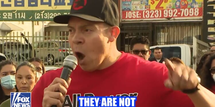 A school teacher identified as Ron Gochez is under investigation for telling a crowd "they're not the only ones with guns!" during an anti-ICE protest.