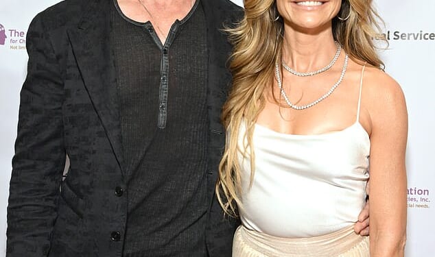 Denise Richards' ex Aaron Phypers has been arrested outside of court over charges of 'spousal abuse' on Friday amid their ongoing divorce battle; seen in May in Universal City