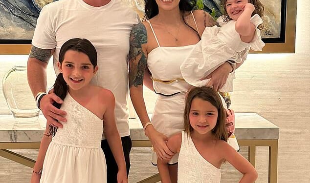 Christopher Scholtes is said to have been watching porn while his two year-old daughter Parker (pictured above being held by her mother Erika) died in a hot car