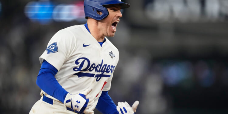 Los Angeles Dodgers' Freddie Freeman celebrates his walk off home run against the Toronto Blue Jays during the 18th inning in Game 3 of baseball's World Series in Los Angeles on Monday.