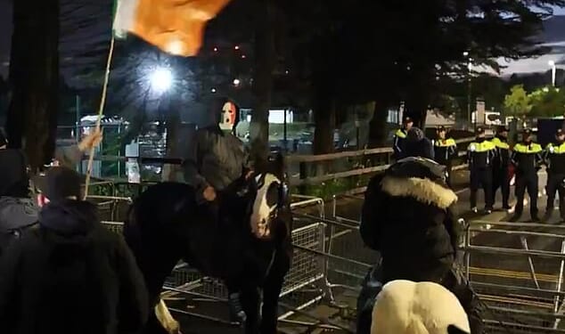 Marauding hordes of masked yobs – some on horseback (pictured) - descended on the prosperous Dublin suburb of Saggart armed with rocks, fireworks and even fire bombs