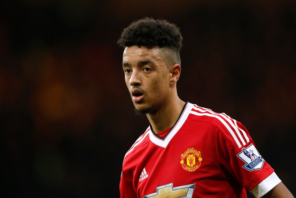 Manchester United player Cameron Borthwick-Jackson in a red jersey with the Manchester United crest.
