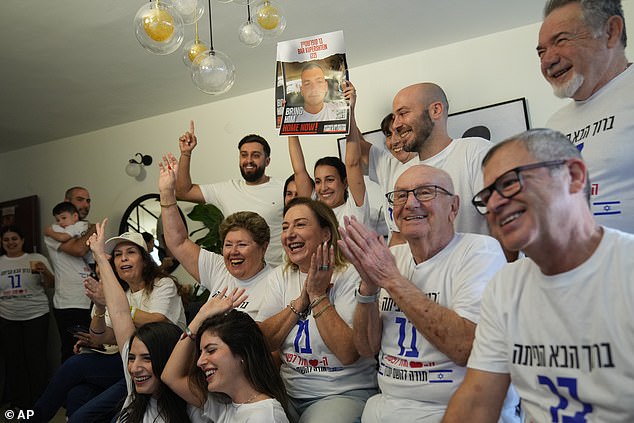 Family and friends of Israeli hostage Bar Kupershtein celebrate as they await the release of Kuperstein and other hostages from Hamas captivity in Gaza, in Holon, Israel, Monday, Oct. 13, 2025. (AP Photo/Francisco Seco)