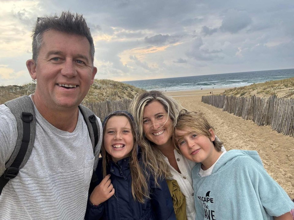 Zack Van Aarde with his wife Jess, daughter Hannah, and son Joshua at a beach.