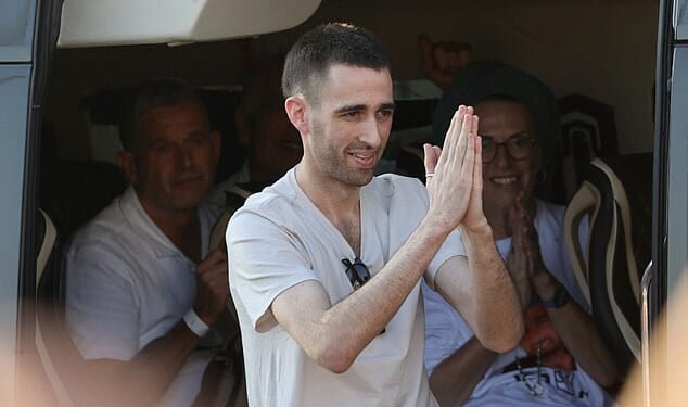 Released Israeli hostage Avinatan Or greets well-wishers upon arriving at Beilinson Hospital in the Rabin Medical Centre in Petah Tikva in central Israel on October 13, 2025