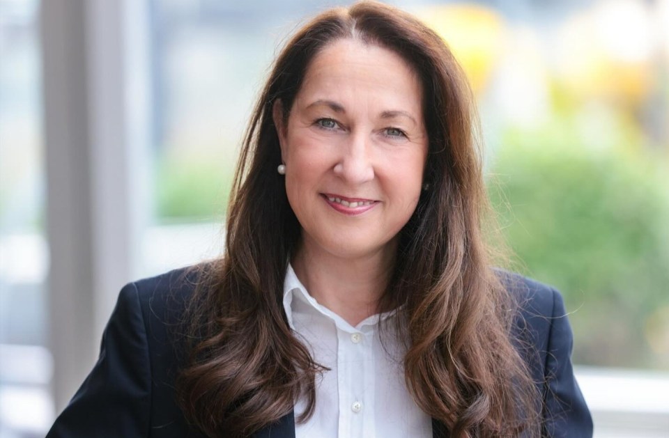 Portrait of Iris Stalzer smiling.