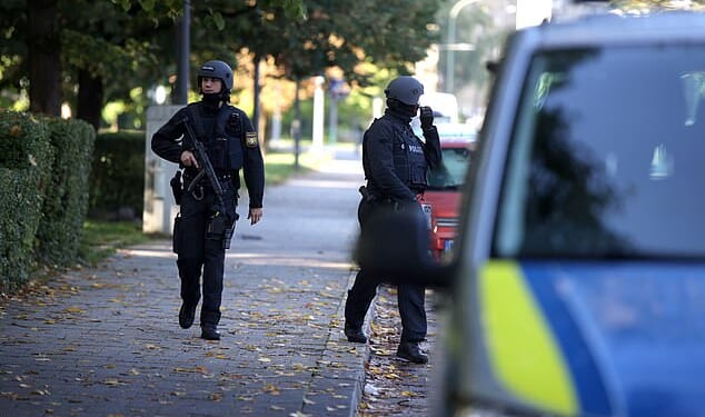 Special police forces at the scene after explosive devices were found in a burning house in Munich, Germany, October 1 2025