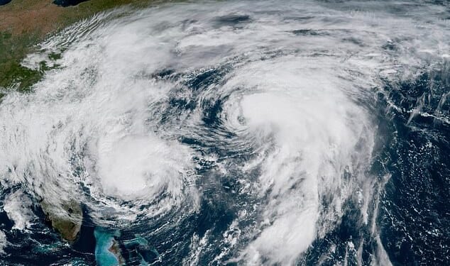 A satellite image shows Hurricane Imelda (left) and Humberto (right) in the Atlantic yesterday