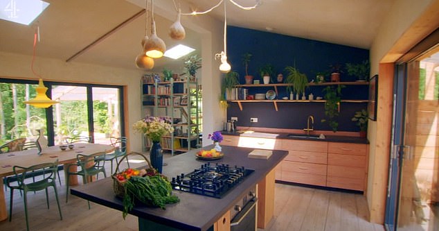 The very modern interior of the home (pictured) contrasted with its wooden exterior