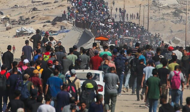 The Israeli military said the ceasefire agreement with Hamas came into effect at noon local time (10am BST) on October 10 and that troops are withdrawing to the agreed-upon deployment lines. Pictured: Palestinians who were displaced to the southern part of Gaza at Israel's order during the war return to Gaza City